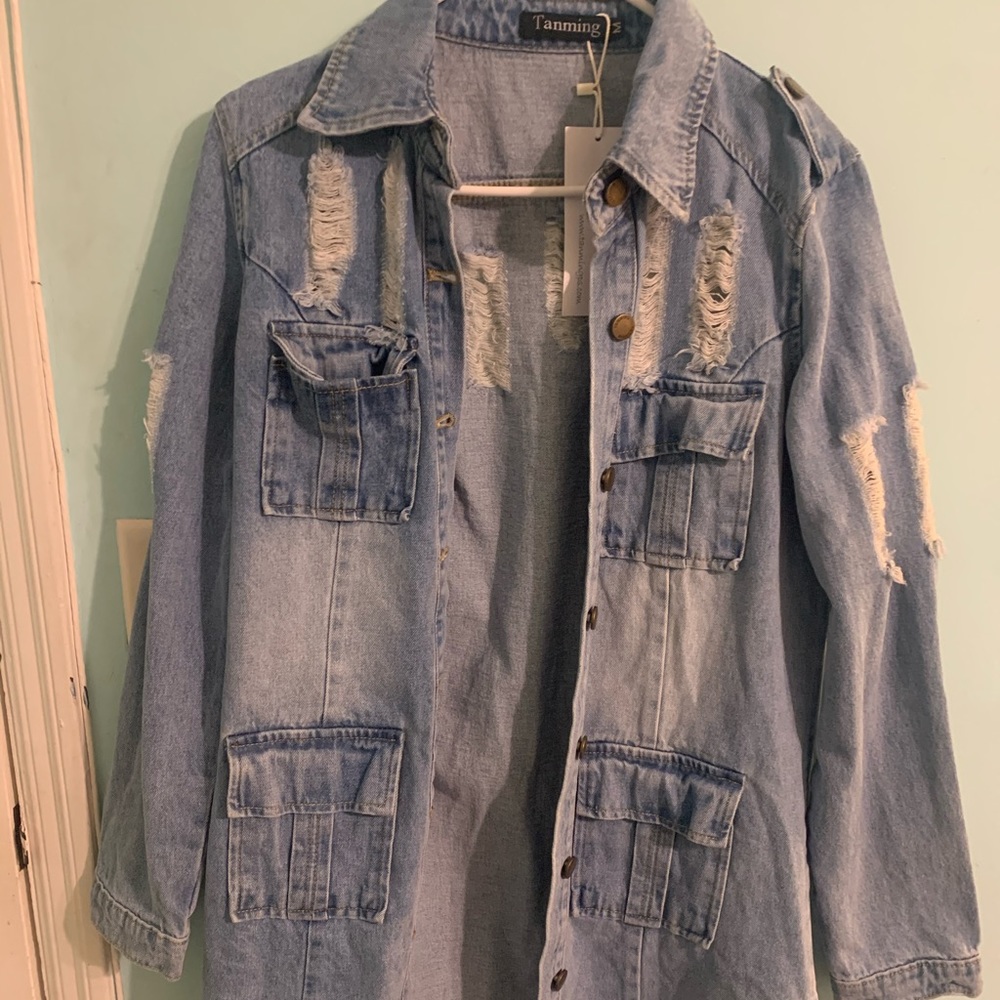 Label is Tanming still has tag on never worn